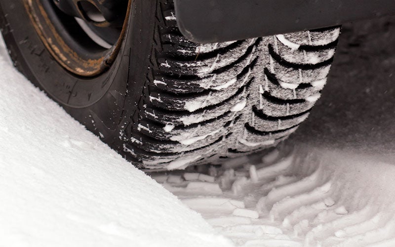 Car tire on snow